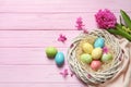 Flat lay composition with painted Easter eggs on wooden table Royalty Free Stock Photo
