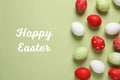 Flat lay composition with painted eggs and text Happy Easter Royalty Free Stock Photo