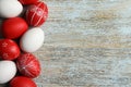 Flat lay composition of painted red Easter eggs on table, space for text Royalty Free Stock Photo