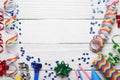 Flat lay composition with party items on white wooden table, space for text. Birthday celebration Royalty Free Stock Photo