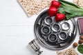 Flat lay composition with Passover Seder plate keara on wooden table. Pesah celebration