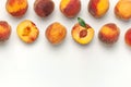 Flat lay composition with peaches. Ripe juicy peaches with green leaves on white background. Flat lay, top view, copy space. Royalty Free Stock Photo