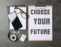 Flat lay composition with phrase CHOOSE YOUR FUTURE on grey background Royalty Free Stock Photo