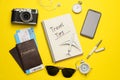 Flat lay composition with phrase Travel Tips written in notebook, passports, tickets and toy airplane on yellow background Royalty Free Stock Photo