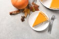 Flat lay composition with piece of fresh delicious homemade pumpkin pie Royalty Free Stock Photo