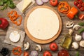 Flat lay composition pizza crust and fresh ingredients