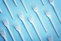 Flat lay composition with plastic forks on color background Royalty Free Stock Photo