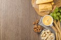 Flat lay composition with pot of tasty cheese fondue on wooden table, space for text Royalty Free Stock Photo