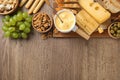 Flat lay composition with pot of tasty cheese fondue on wooden table Royalty Free Stock Photo