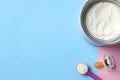 Flat lay composition with powdered infant formula on color background, space for text. Baby milk Royalty Free Stock Photo