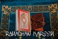 Flat lay composition of Qoran, Dates and tasbih rosary beads on top of a sajadah praying mattress