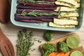 Composition with raw cut carrots in baking dish on wooden table Royalty Free Stock Photo