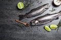 Flat lay composition with raw cutthroat trout fish on table Royalty Free Stock Photo