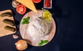 Flat lay composition with raw dough and ingredients for pizza. Basil, tomatoes, cucumbers, olive oil, tomato sauce. text space, Royalty Free Stock Photo