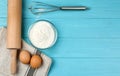 Flat lay composition with raw eggs on blue wooden table, space for text. Baking pie Royalty Free Stock Photo