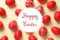 Flat lay composition of red painted eggs and text Happy Easter Royalty Free Stock Photo