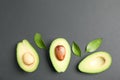 Flat lay composition with ripe avocados on black background, space for text Royalty Free Stock Photo