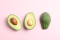 Flat lay composition with ripe avocados on color background, space for text Royalty Free Stock Photo