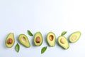 Flat lay composition with ripe avocados on white background Royalty Free Stock Photo
