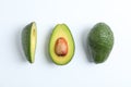 Flat lay composition with ripe avocados on white background, space for text Royalty Free Stock Photo