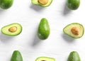 Flat lay composition with ripe avocados on white wooden background Royalty Free Stock Photo
