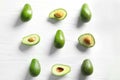 Flat lay composition with ripe avocados on white wooden background Royalty Free Stock Photo