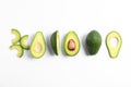 Flat lay composition with ripe cut avocados on white background Royalty Free Stock Photo