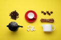 Flat lay composition with roasted beans and geyser coffee maker on yellow background Royalty Free Stock Photo