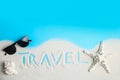 Flat lay composition with sand, sunglasses and word TRAVEL on color background, space for text Royalty Free Stock Photo