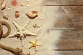 Flat lay composition with seashells, beach sand on wooden background Royalty Free Stock Photo