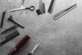 Flat lay composition with set of hairdresser's tools on grey background Royalty Free Stock Photo
