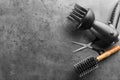 Flat lay composition with set of hairdresser's tools on grey background Royalty Free Stock Photo