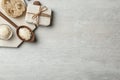 Flat lay composition with Shea butter and handmade soap on light background. Royalty Free Stock Photo