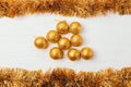 Flat lay composition of shiny gold Christmas tinsel garland Royalty Free Stock Photo