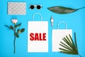 Flat lay composition with shopping bags and word SALE Royalty Free Stock Photo