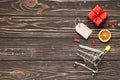 Flat lay Composition of shopping trolleys, red gift box, tag on a brown wooden background Royalty Free Stock Photo