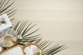 Flat lay composition with shower cap and spa stones on wooden background. Space for text Royalty Free Stock Photo