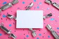 Flat lay composition of silver Christmas crackers with shiny confetti and blank card on pink background. Space for text Royalty Free Stock Photo