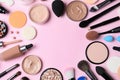 Flat lay composition with skin foundation, powder and beauty accessories on color background