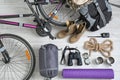 Flat lay composition with sleeping bag, bicycle