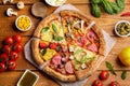 Flat lay composition with slices of delicious pizzas on wooden table