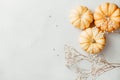 Flat lay composition of small pumpkins on a white background with deco Royalty Free Stock Photo