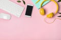 Flat lay composition with smartphone, computer keyboard and headphones on color background Royalty Free Stock Photo