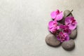 Flat lay composition with spa stones and orchid flowers Royalty Free Stock Photo