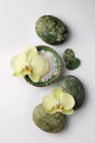 Flat lay composition with spa stones, salt and beautiful flowers on white table Royalty Free Stock Photo