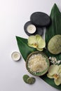 Flat lay composition with spa stones, sea salt and beautiful flowers on white table. Space for text Royalty Free Stock Photo