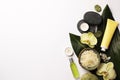 Flat lay composition with spa stones, sea salt and beautiful flowers on white table. Space for text Royalty Free Stock Photo