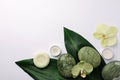 Flat lay composition with spa stones, solid shampoo bar and beautiful flowers on white table. Space for text Royalty Free Stock Photo