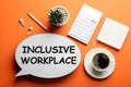 Flat lay composition of speech bubble lightbox with phrase INCLUSIVE WORKPLACE on orange background Royalty Free Stock Photo