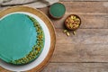 Flat lay composition with spirulina cheesecake on wooden table Royalty Free Stock Photo